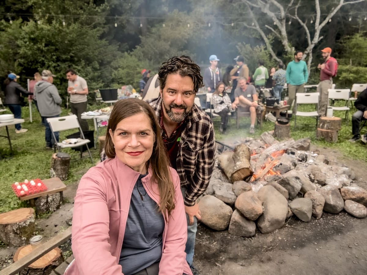 A campfire in the redwoods at the founder gathering where Daymaker Connect began.